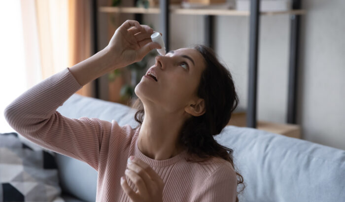 Head,Shot,Young,Caucasian,Woman,Using,Medical,Eyes,Drops,Suffering