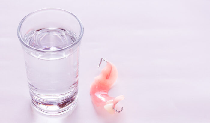 What should I soak my dentures in at night